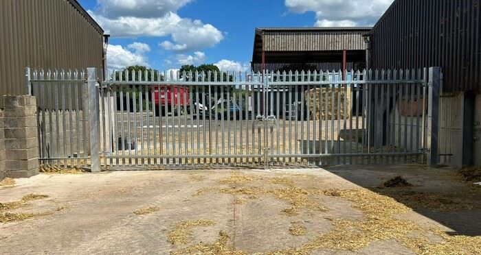 Steel palisade fence and gate at a farm in Benson, Oxfordshire